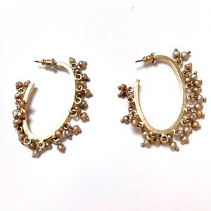Golden hoop earrings with tiny golden pearls
